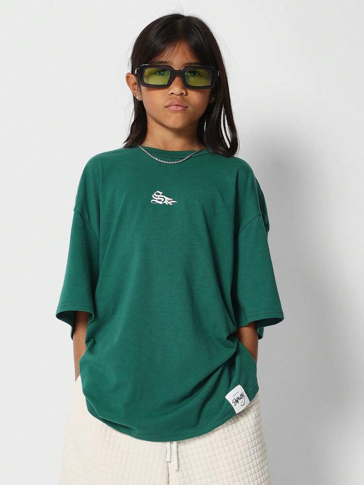 Tee-shirt graphique surdimensionné, imprimé expressif vert, mode des vacances, streetwear casual ajusté lâche, Top d'été unisexe