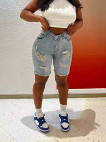 Shorts di jeans attillati strappati di moda da donna