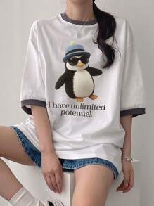 DAZY Camiseta casual de mujer de manga de hombro caído con estampado de dibujos animados de verano y parche con eslogan "Tengo un potencial ilimitado"