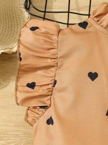 年轻女孩夏季流行心形印花蝴蝶结不对称下摆上衣和长裤两件套户外休闲装