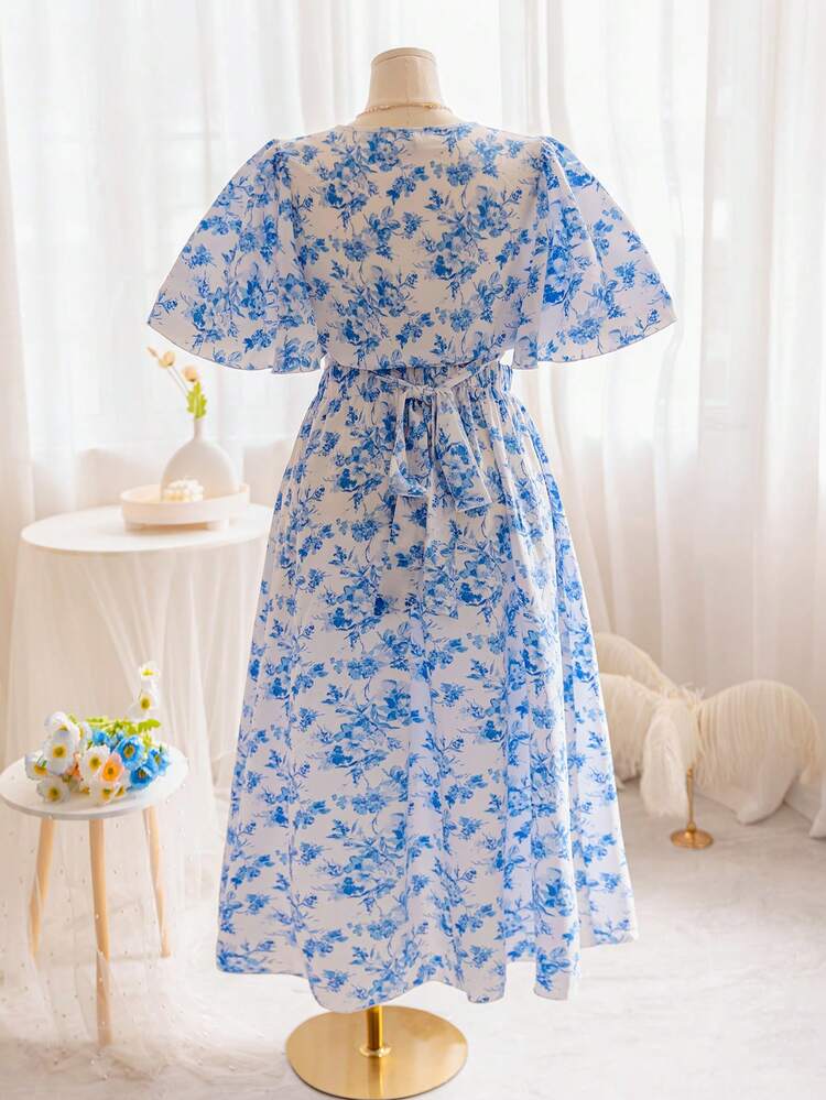 Plus Size Women's V-Neck Crisscross Bell Sleeve Top With Elastic Waist Asymmetrical Hem High-Low Shirt And Blue/White Floral Maxi Skirt Set For Vacation Style