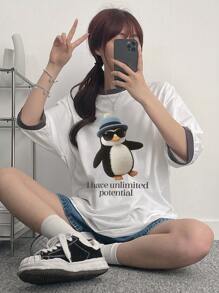 DAZY Camiseta casual de mujer de manga de hombro caído con estampado de dibujos animados de verano y parche con eslogan "Tengo un potencial ilimitado"