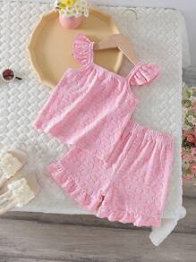 Ensemble enfant fille avec un haut fleuri à manches courtes et un short pour l'été