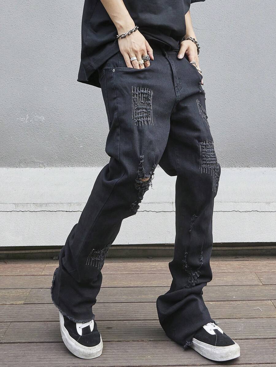 Manfinity EMRG Men's Slim Flared Jeans With Distressed Pockets And Ripped Design