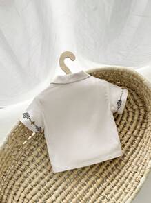 Cozy Pixies 嬰兒男孩休閒花紋短袖針織開衫，翻領款式