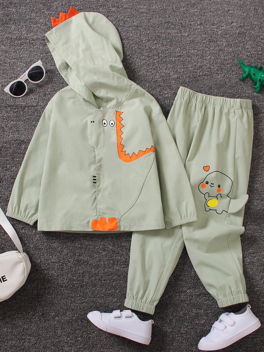 SHEIN 2 Stücke Set aus süßer langärmliger Kapuzenjacke mit Dinosaurier-Aufdruck für Kleine Jungen und lockerer Hose mit 3D-Dinosaurier-Motiv, geeignet für die tägliche Freizeitkleidung