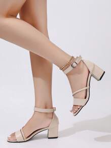 女士米色真皮6厘米粗跟性感露趾绑带凉鞋，时尚通勤之选。