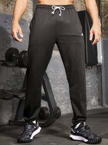 Manfinity Sport Corelite Boyfriend Style Men's Solid Color Drawstring Waist Pocketed Casual Sweatpants