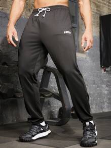 Manfinity Sport Corelite Boyfriend Style Men's Solid Color Drawstring Waist Pocketed Casual Sweatpants