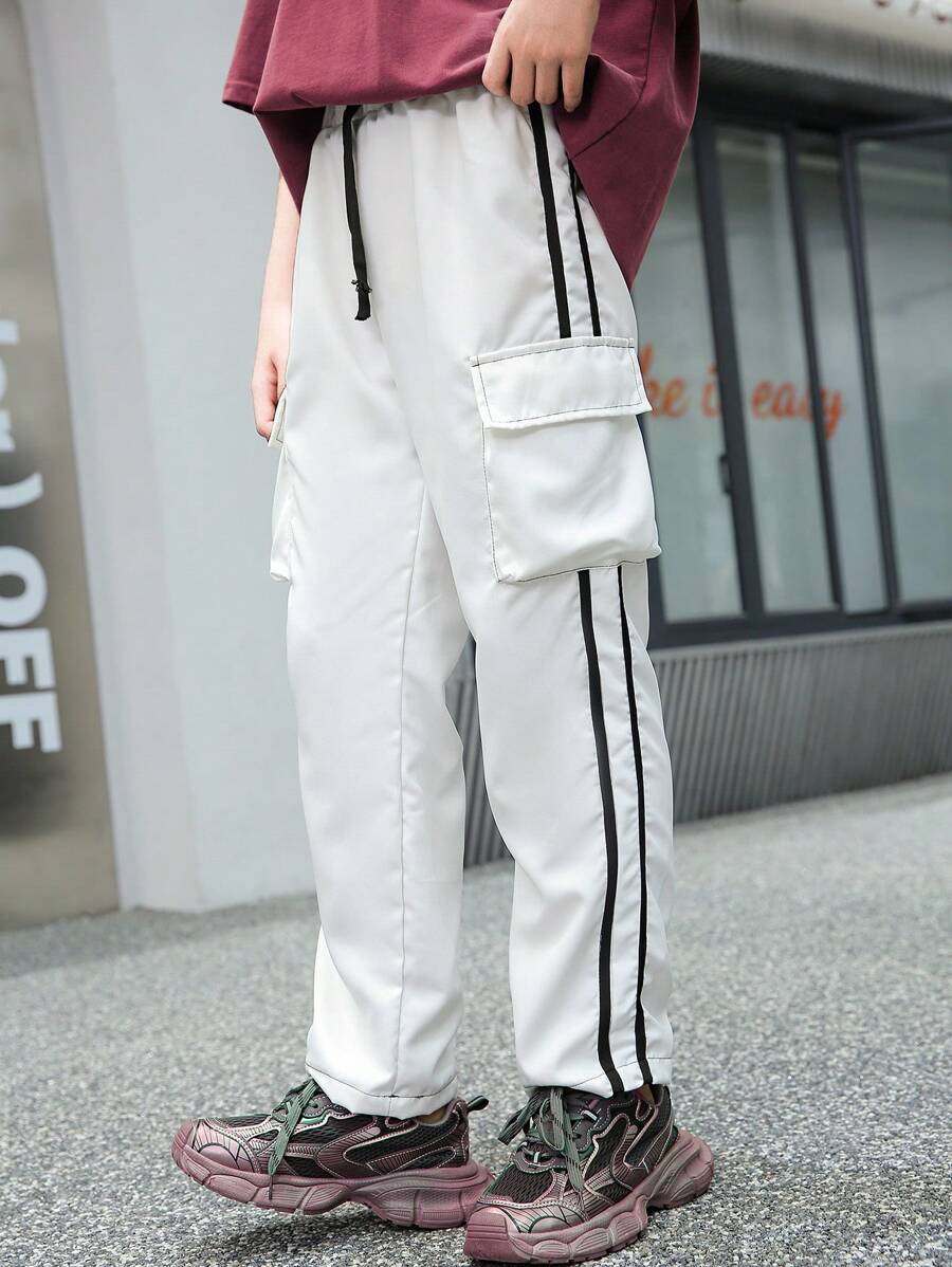 SHEIN Modische gestreifte lange Mädchenhose mit seitlichem Taschendesign, Größe 6-1-1 - Schwarz und Weiss - Übersicht 1