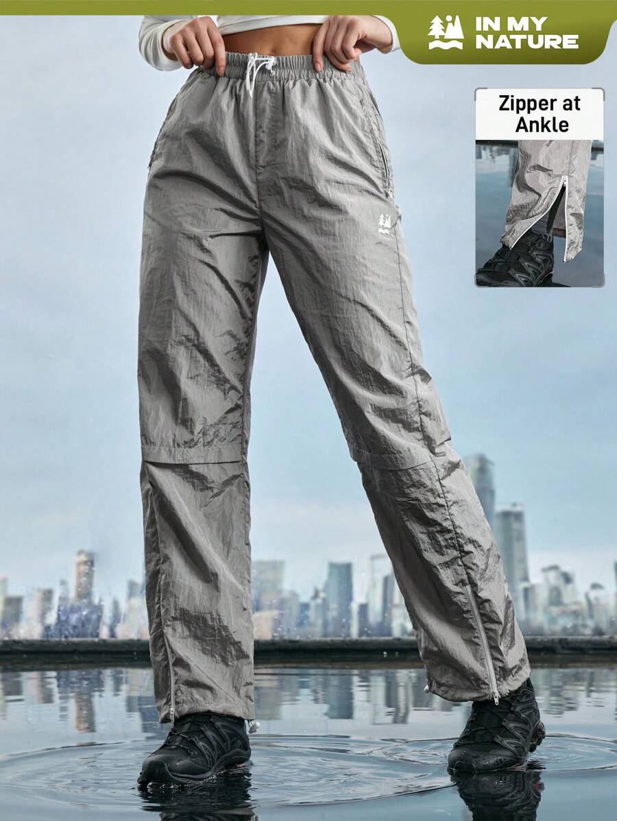 In My Nature Pantalones deportivos a prueba de viento para mujer, para senderismo, correr, entrenar, ideal para desplazarse por la ciudad - Plateado - Ver 1