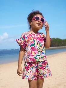 SHEIN Conjunto de top holgado con volantes y hombros descubiertos y pantalones cortos estampados de vacaciones para niñas jóvenes
