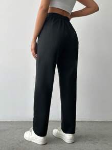 Pantaloni uni cu șnur în talie