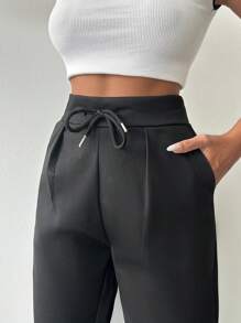 Pantaloni uni cu șnur în talie