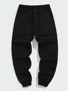 Manfinity Dauomo Pantalones jogger para hombre con diseño estampado de lema, cintura con cordón, bolsillos y bajo con puño para rave