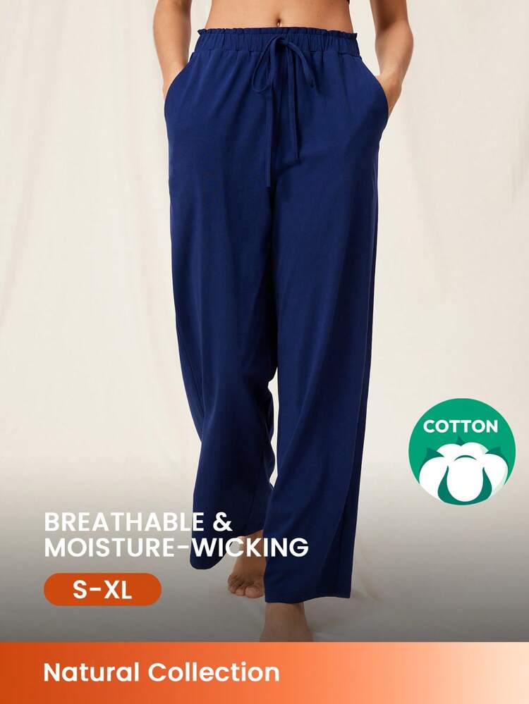 Pantalon de pyjama en coton pur à large coupe, doux et aéré, en tissu bleu d'été pour femme. Peut être porté comme vêtement d'extérieur.