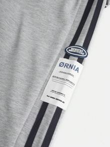 青少年男孩側邊條紋印花運動長褲，有彈性的腰圍和貼花裝飾