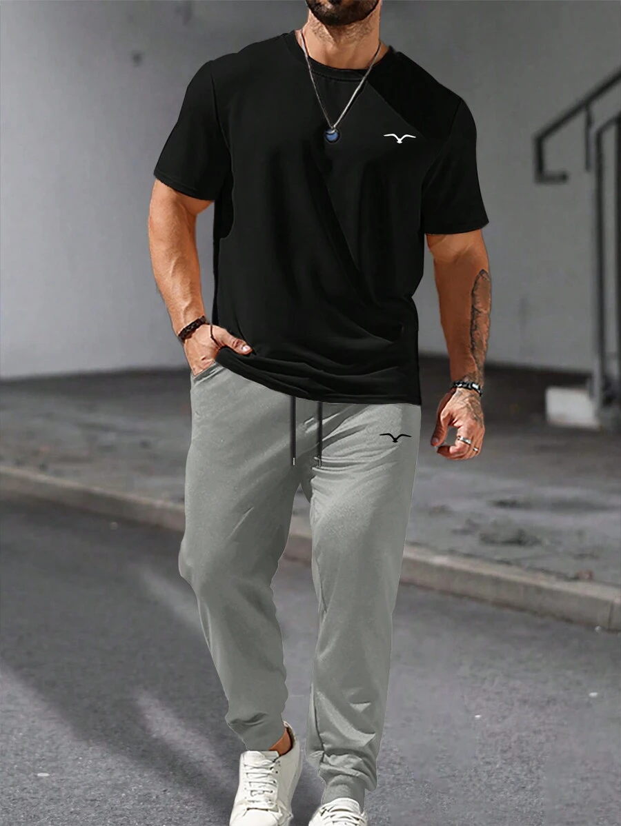 Manfinity Homme Conjunto de camiseta casual de manga corta con cuello redondo y estampado de gaviotas de verano para hombre y pantalón largo con cintura de cordón - Multicolor - Ver 1