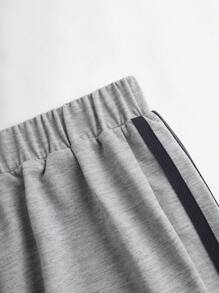 青少年男孩側邊條紋印花運動長褲，有彈性的腰圍和貼花裝飾