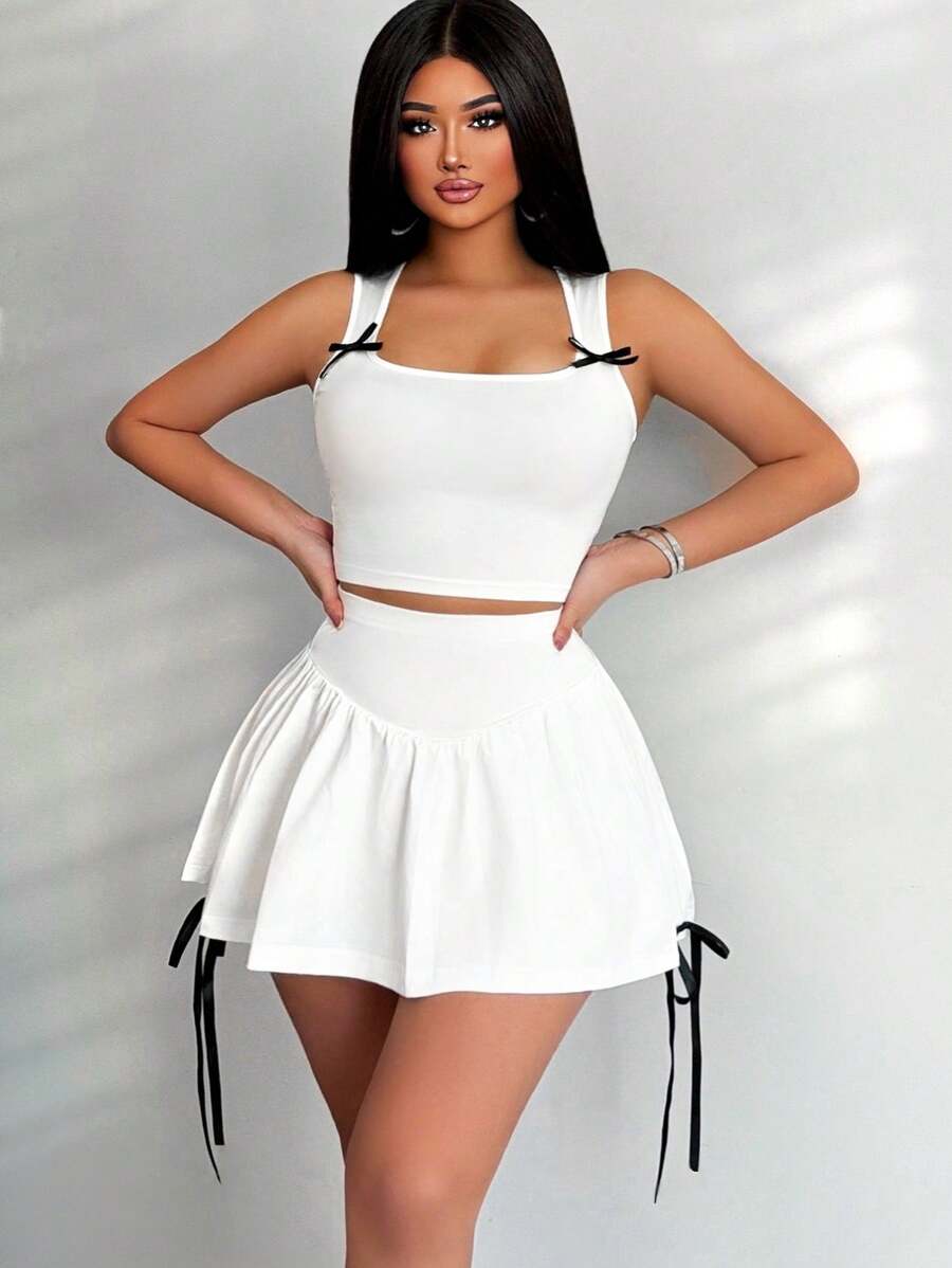 Zolique مجموعة قميص بدون أكمام بزخرفة القوس للنساء وتنورة قصيرة للغاية للصيف، 2 قطعة - أبيض - مشاهدة 1