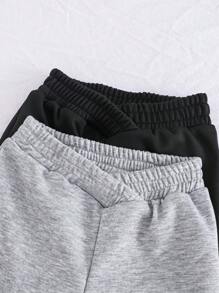 SHEIN Explorewe 这款两件装女童休闲百搭时尚运动裤，采用灰色和黑色拼接设计，既时尚又实用，能让您的小潮人穿出靓丽风采。腰部独特的交叉设计，为这款运动裤增添了一丝精致现代感，有别于传统款式。 - 彩色 - 查看 3