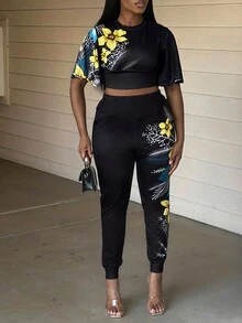 LovelyWholesale Conjunto pantalones con top de manga con volante con estampado floral - Negro - Ver 3