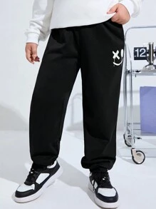 SHEIN Kids/Tween Boys' Extended Size Casual Night-Glow Green Printed Loose Fit Knitted Solid Color Sweatpants Trousers