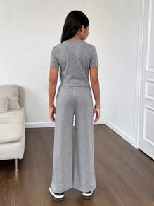 SHEIN 2pcs Spring/Summer Knitwear Set For Tween Girls, Including A Solid Round Neck Short Sleeve Top With Patches And Straight-Leg Pants