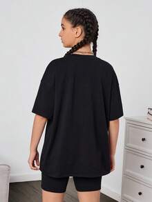 SHEIN Teen Nữ Họa Tiết Gấu Đen Graffiti Chữ Rời Áo Thun Và Quần Đi Xe Đạp Thể Thao Dạo Phố Casual 2 Bộ - màu đen - Xem 2