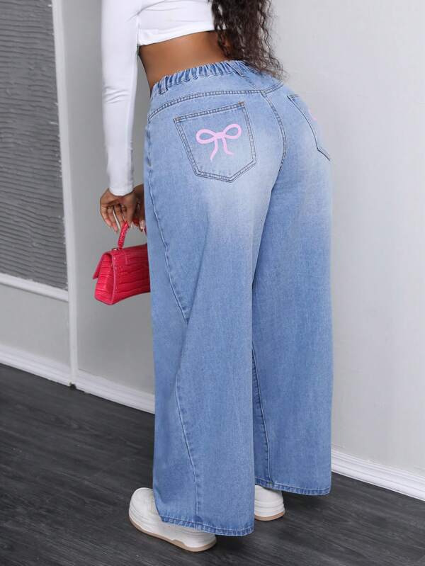 SHEIN SXY Jeans rectos de talla grande de ajuste holgado y pierna ancha con estampado de lazo de moda