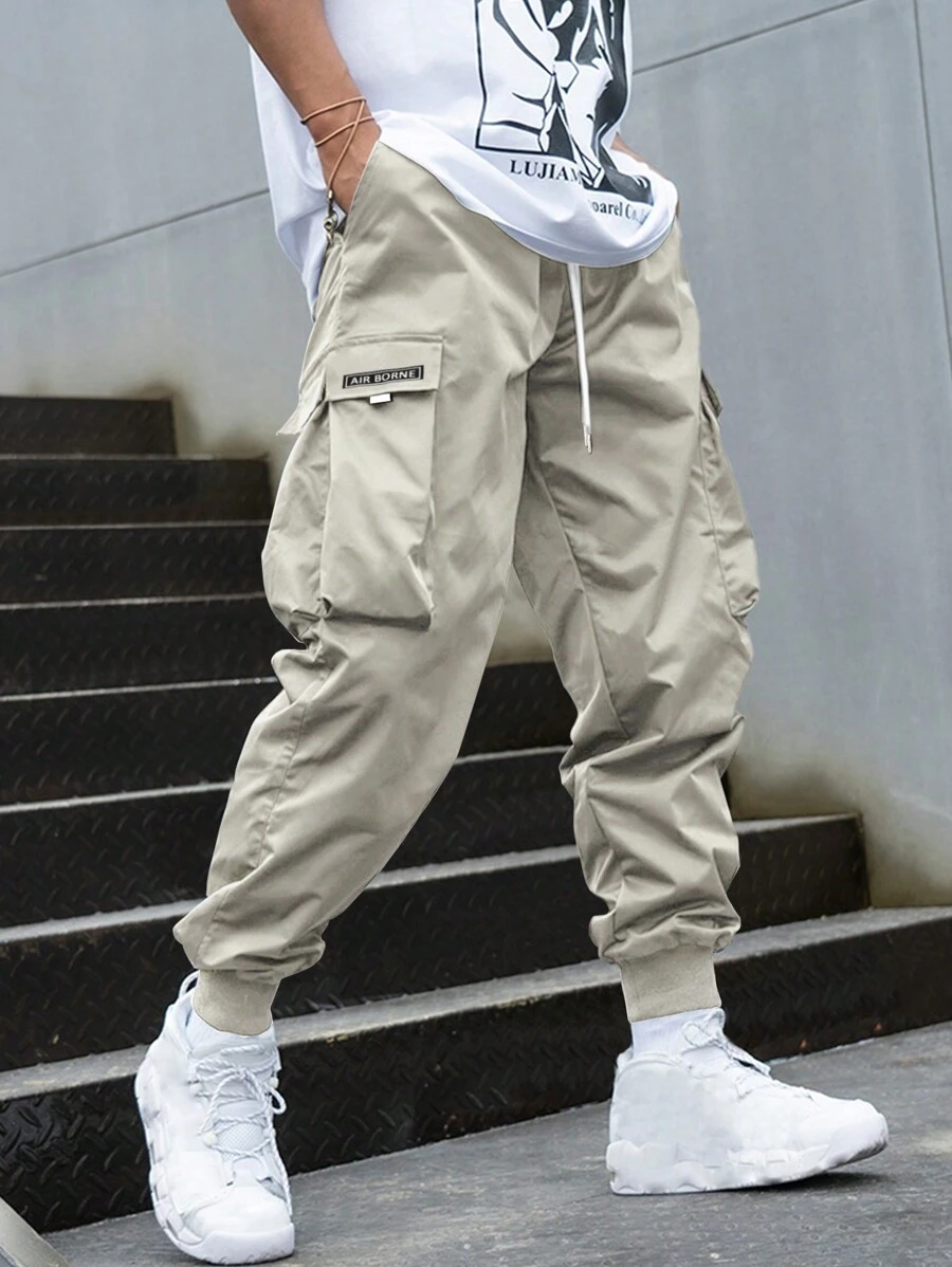 Manfinity Hypemode Loose Fit Men's Letter Graphic Cargo Pants With Flap Pockets And Drawstring Waist - Apricot - View 1