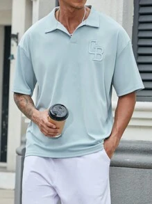 Manfinity Homme 男款天藍色鬆身Polo衫，配有刺繡領子