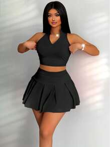 Zolique Conjunto de top de tanque con cremallera de media parte delantera de unicolor y falda corta plisada de unicolor, estilo académico sexy y juguetón