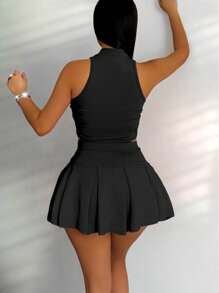 Zolique Conjunto de top de tanque con cremallera de media parte delantera de unicolor y falda corta plisada de unicolor, estilo académico sexy y juguetón