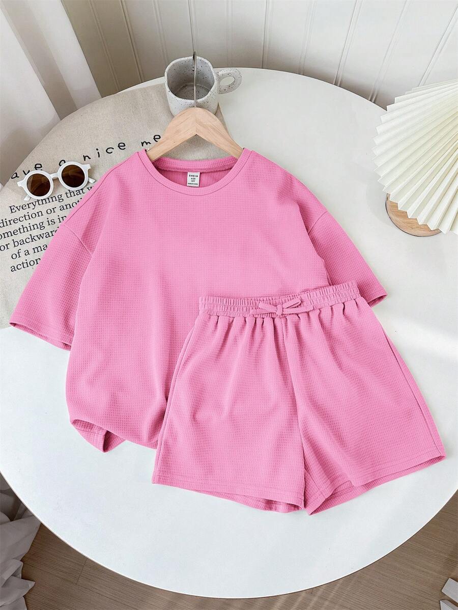 SHEIN LMoss Kids Bộ 2 món áo len tay ngắn trơn và quần short rộng rãi cho bé gái tuổi mới lớn LMoss - Màu Hồng  Dưa hấu - Xem 1