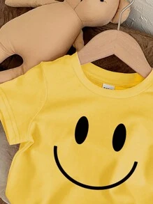 SHEIN Kurzärmeliges Baby Mädchen Top mit lächelndem Gesicht Muster, geeignet für den Sommer