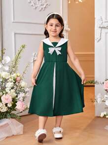 SHEIN Holiday,Summer,Travel  Young Girl Green Sleeveless Patchwork Dress . The Dress Is Mainly In Fresh Green, Showing A Natural And Energetic Atmosphere. There Is An Exquisite Bow On The Chest, Which Makes The Dress More Playful And Cute. The Patchwork Part Of The Skirt Is Made Of White Textured Fabric, Which Makes The Dress More Layered And Three-Dimensional. It Is Suitable For Daily Leisure, Outdoor Travel, Outdoor Activities, And Suitable For Spring And Summer Seasons. - Dark Green - View 6