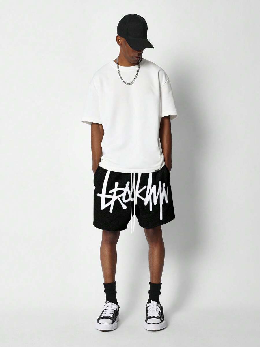 SUMWON Drop Crotch Short With Front Graphic Print - Black - View 1