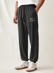 Manfinity VCAY Pantalones de punto sueltos para hombre con cinturilla elástica y puños acanalados, con patrón impreso en inglés de moda y para uso diario