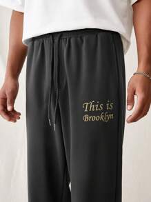 Manfinity VCAY Pantalones de punto sueltos para hombre con cinturilla elástica y puños acanalados, con patrón impreso en inglés de moda y para uso diario