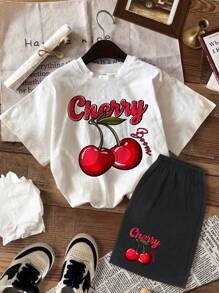 SHEIN Conjunto de 2 piezas de top de manga corta con estampado de cerezas y shorts estilo casual y lindo para niñas jóvenes, de mezcla de algodón, para el verano