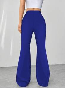 Flirla Pantalones acampanados con textura de pata de gallo en blanco y negro