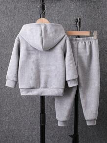 Young Boy Textured Knit Fleece Tracksuit, Suitable For 4-7 Years Old Boys To Wear During Outings, School And Sports In Autumn, Winter And Spring. The Tracksuit Is Made Of Textured Knit Fleece Material, Which Is Warm And Comfortable. The Hoodie Is Designed With A Hood, Enhancing The Fashion Sense And Warmth. It Is Suitable For Boys To Wear On Various Occasions, Not Only Fashionable But Also Practical, And Allowing Easy Movement. When Boys Wear This Tracksuit, Whether It's Outdoor Activities, Going To School, Or Exercising, They Can Show Off A Fashionable And Stylish Image. This Tracksuit Will Become A Fashionable And Warm Item In The Young Boy Wardrobes, Providing More Choices For Their Daily Wear!