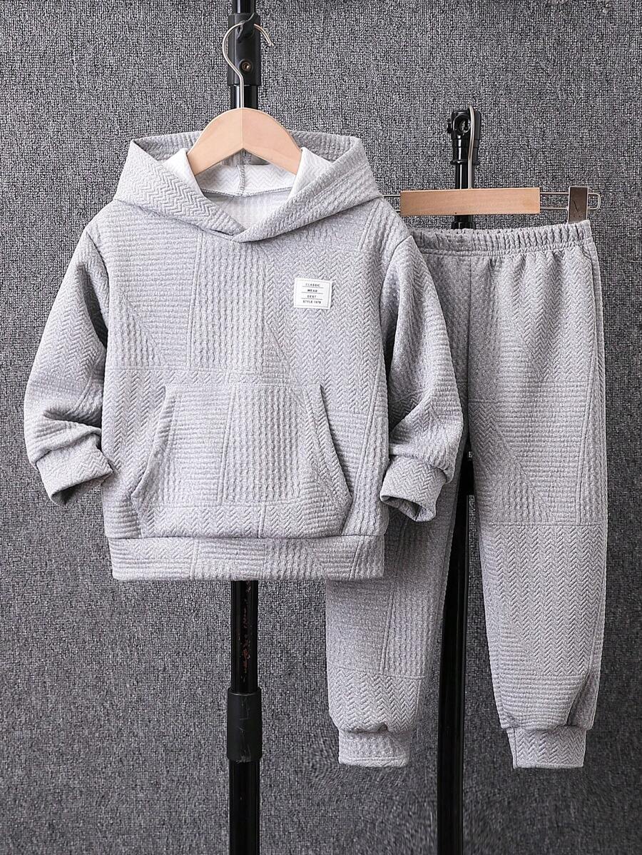 Young Boy Textured Knit Fleece Tracksuit, Suitable For 4-7 Years Old Boys To Wear During Outings, School And Sports In Autumn, Winter And Spring. The Tracksuit Is Made Of Textured Knit Fleece Material, Which Is Warm And Comfortable. The Hoodie Is Designed With A Hood, Enhancing The Fashion Sense And Warmth. It Is Suitable For Boys To Wear On Various Occasions, Not Only Fashionable But Also Practical, And Allowing Easy Movement. When Boys Wear This Tracksuit, Whether It's Outdoor Activities, Going To School, Or Exercising, They Can Show Off A Fashionable And Stylish Image. This Tracksuit Will Become A Fashionable And Warm Item In The Young Boy Wardrobes, Providing More Choices For Their Daily Wear!