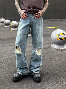 Manfinity Roghcode Y2K復古街頭風格男士中藍色洗水染污損寬腳寬鬆牛仔褲，帶沙漠風格