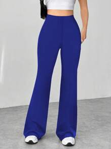 Flirla Pantalones acampanados con textura de pata de gallo en blanco y negro