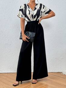 Chiquease Enterizo negro elegante con mangas cortas con impresión gráfica en contraste blanco y negro con corte aleatorio para el verano y escote en V - Albaricoque - Ver 1