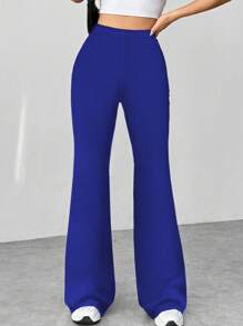 Flirla Pantalones acampanados con textura de pata de gallo en blanco y negro