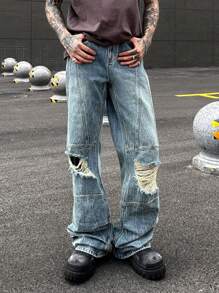 Manfinity Roghcode Y2K復古街頭風格男士中藍色洗水染污損寬腳寬鬆牛仔褲，帶沙漠風格