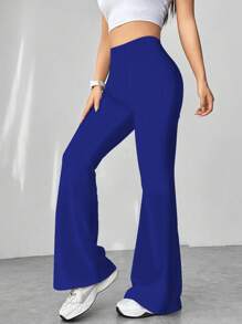 Flirla Pantalones acampanados con textura de pata de gallo en blanco y negro